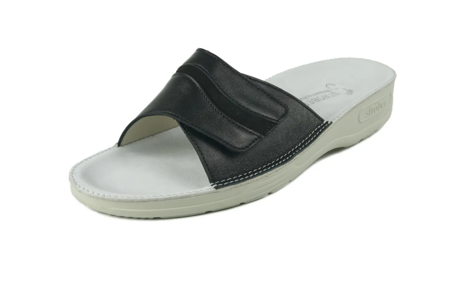 Schwarze ALINA Nappa + Nubuk Schuhe, elegant auf einem grauen Hintergrund platziert, zeigen ein raffiniertes Design.