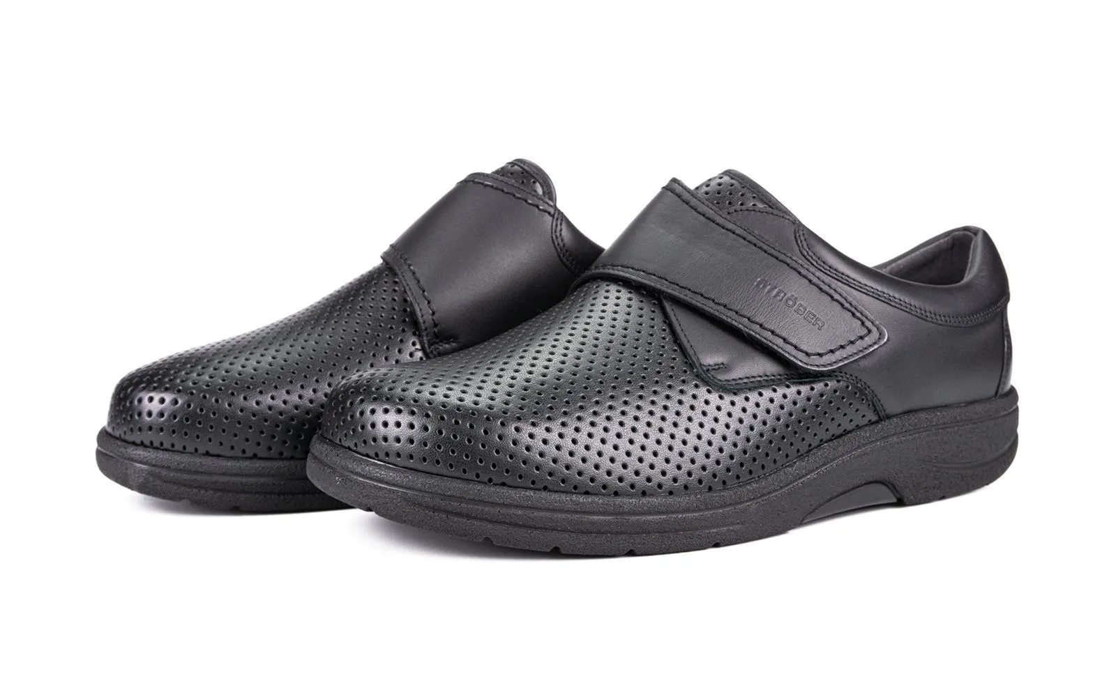 Schwarze MANOLO Schuhe aus Nappa und StretchNappa, elegant positioniert auf einem stilvollen Untergrund.